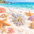 Smiley Flower Cage Pendant with Pink Pearl on Beach